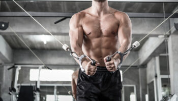 Athletic,Fitness,Man,Doing,Cable,Tower,Pulling,Exercises,Fitness,Working