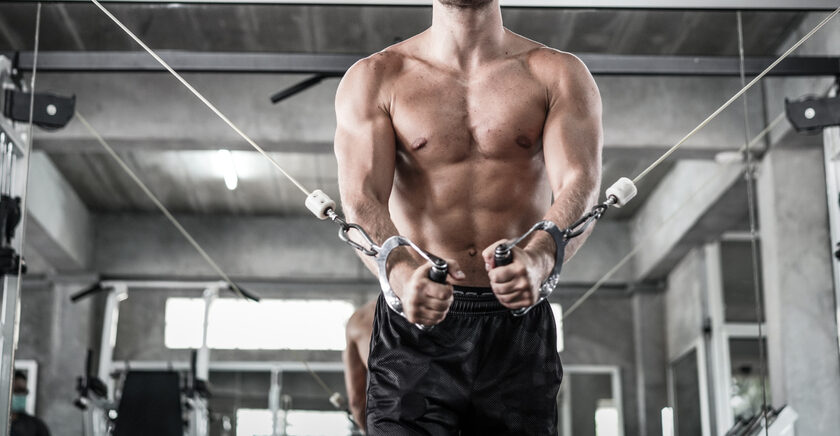 Athletic,Fitness,Man,Doing,Cable,Tower,Pulling,Exercises,Fitness,Working